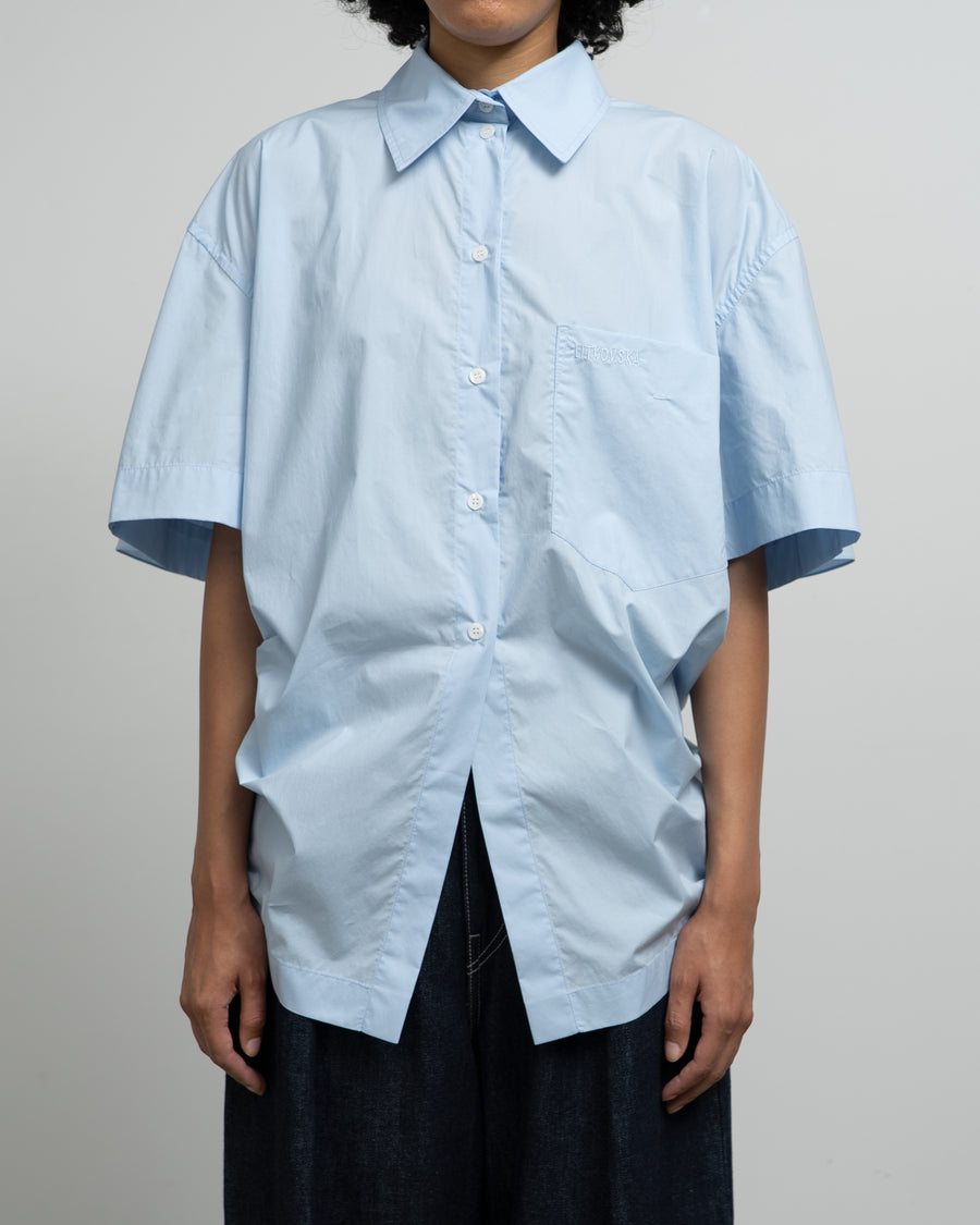 BLUE COTTON SHIRT WITH A TWISTED BACK
